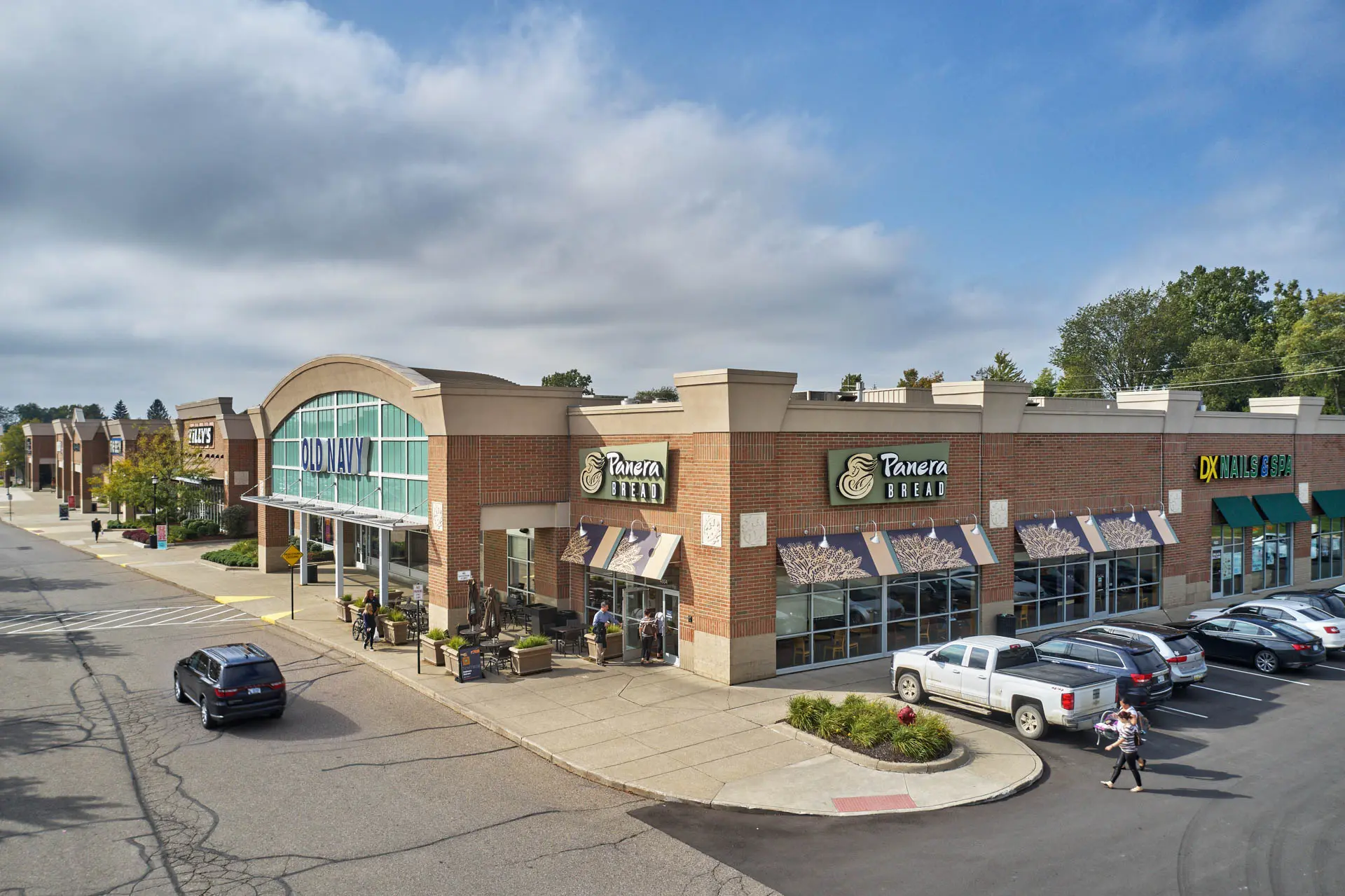 Shopping center featuring Old Navy, Panera Bread and neighboring retail storefronts.