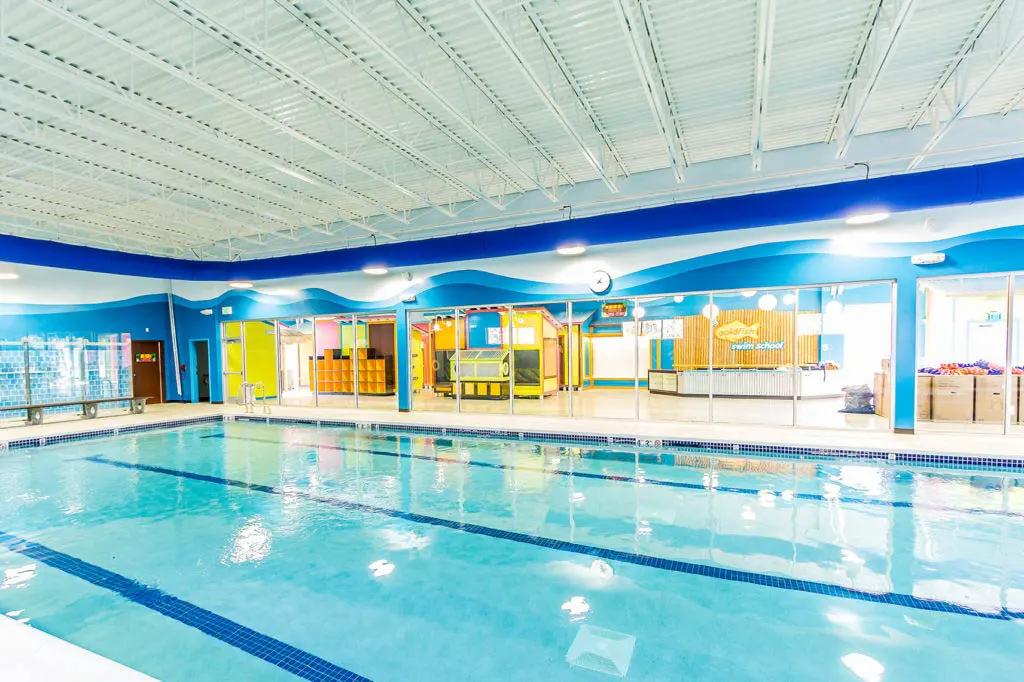 Indoor Goldfish Swim School pool with swimming lanes and colorful aquatic-themed interior.